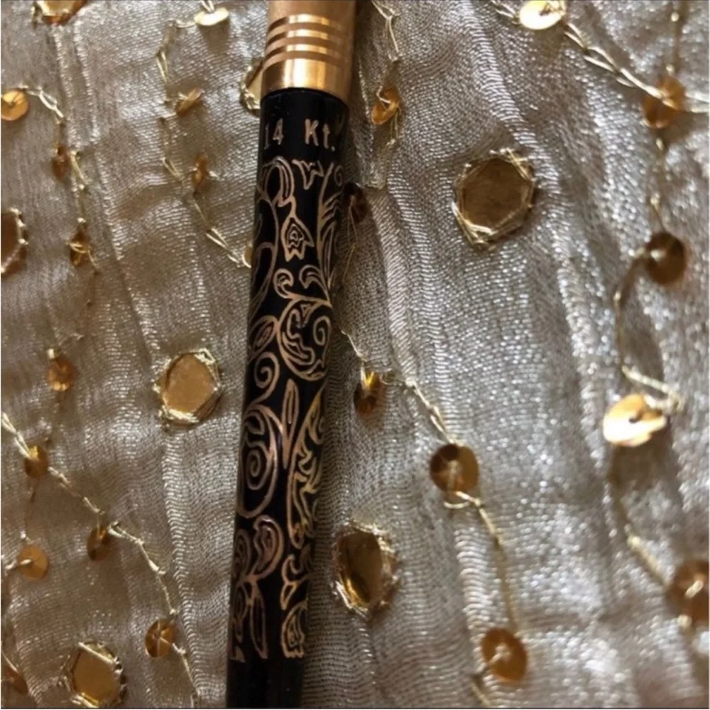 14K gold filigree pen.